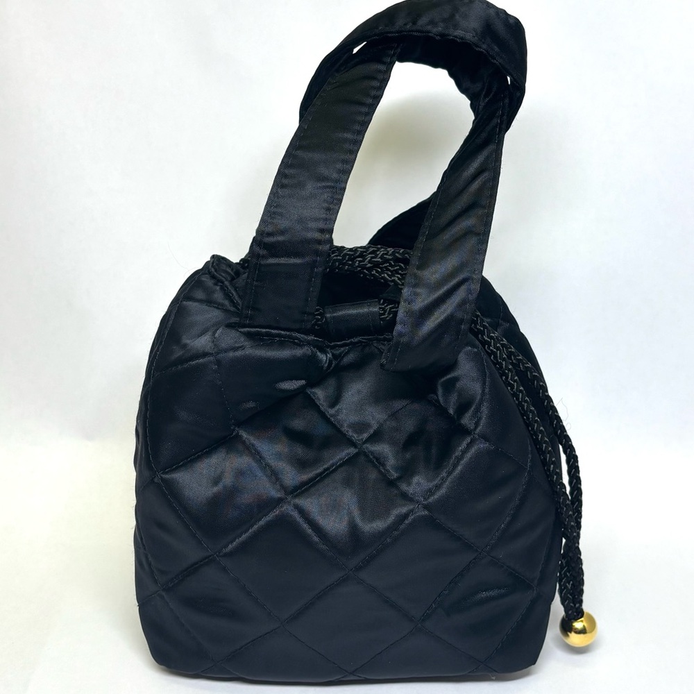 Lancôme small, black quilted makeup bag